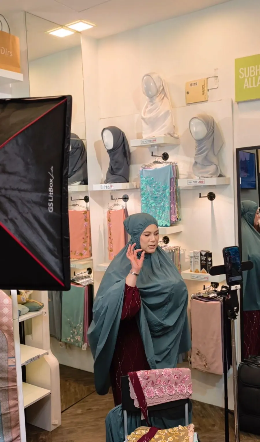 Host presenting modest fashion in a live-selling session